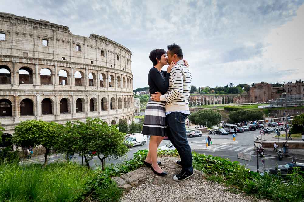 Kissing in Rome at the roman coliseum in Rome Italy