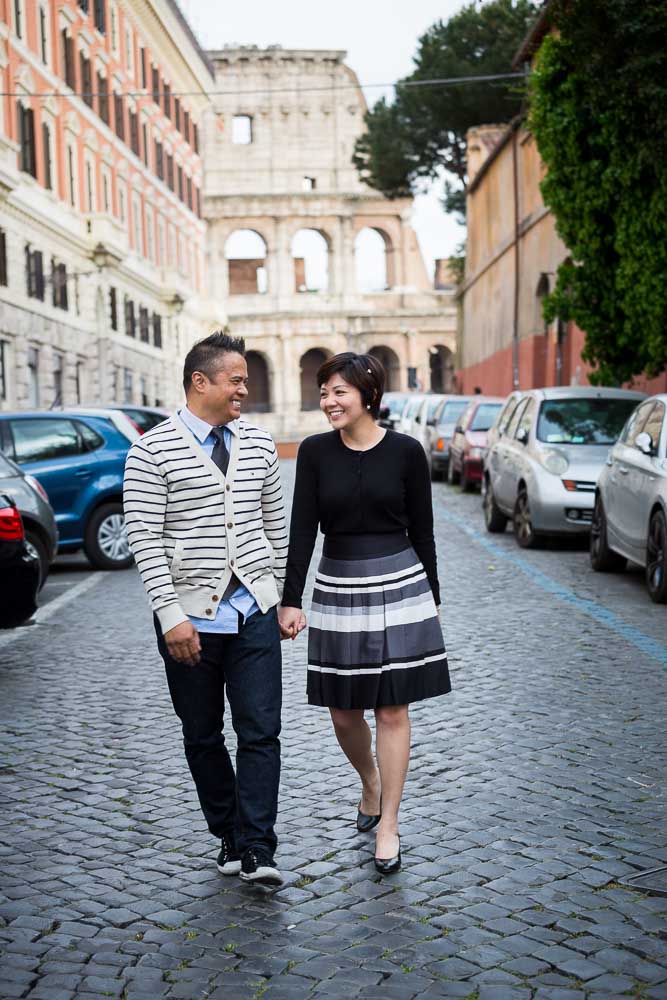 Walking on cobble stone streets with the Colosseum in the background