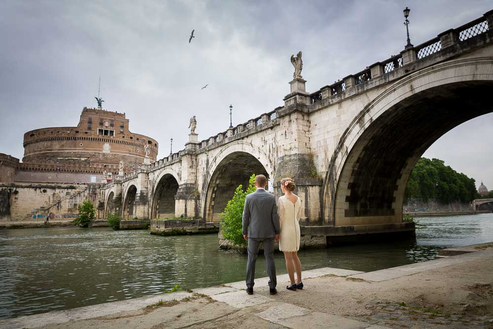 Couple wedding day photo session underneath the Castel Sant Angelo bridge in Rome Italy