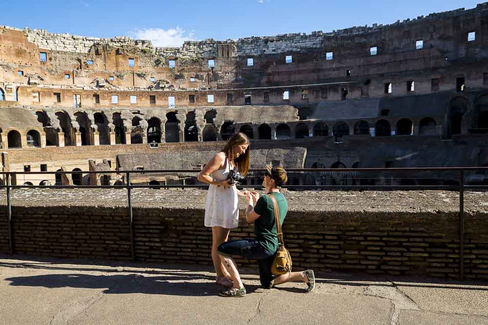 Wedding proposal picture taken inside the Collosseum in Rome Italy.