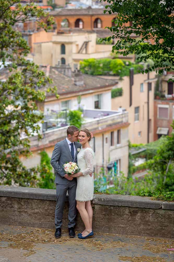 Overview of a bride and groom before the roman rooftops