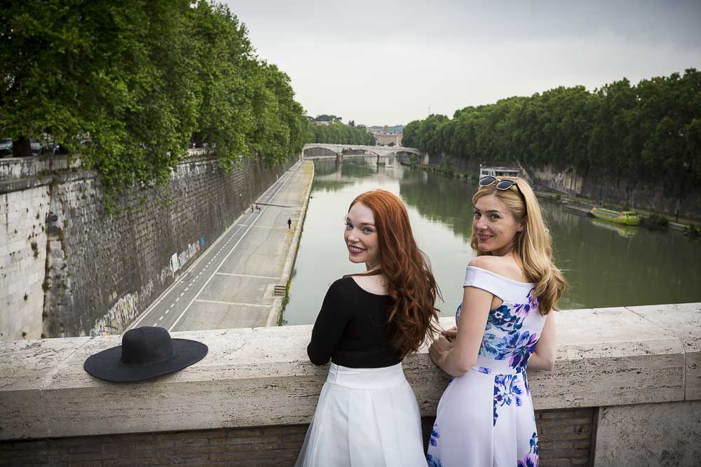 Friend coupe looking back during a photography session over the roman Tiver river