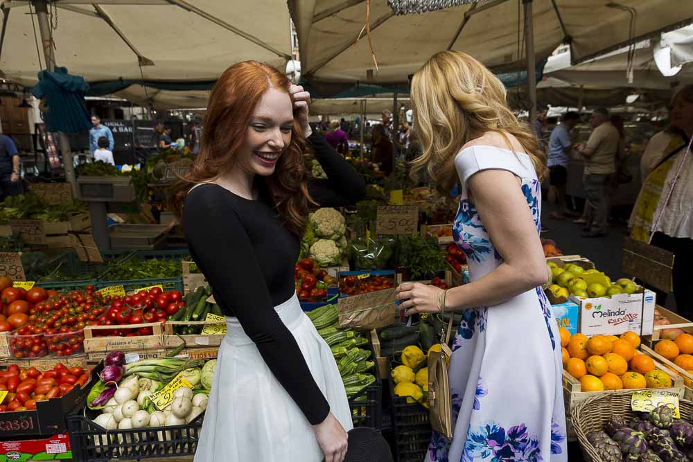 Shopping for fruits and vegetables inside the Campo dei Fiori morning market