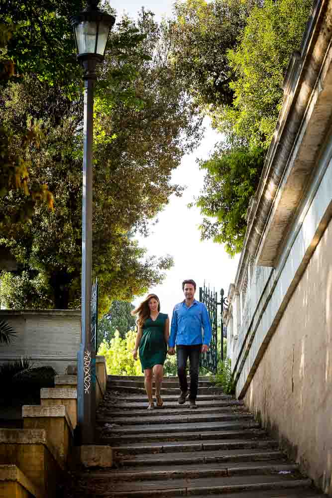 Couple walking down the steps in Parco del Pincio