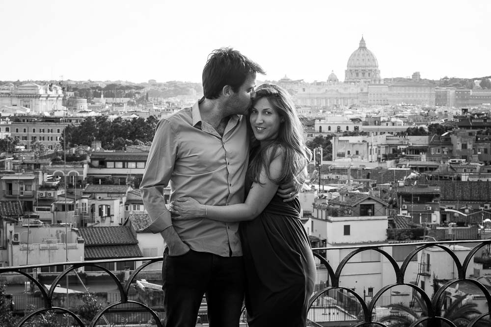 Black and white image of a couple over the roman rooftops
