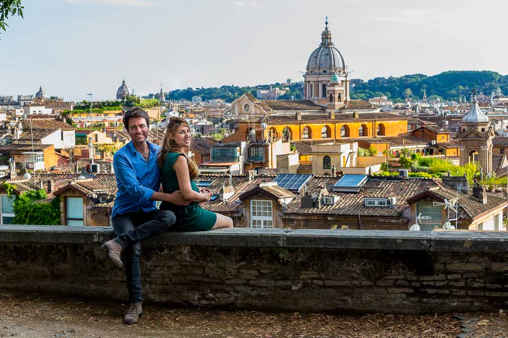 Couple sitting down observing the view of the ancient city