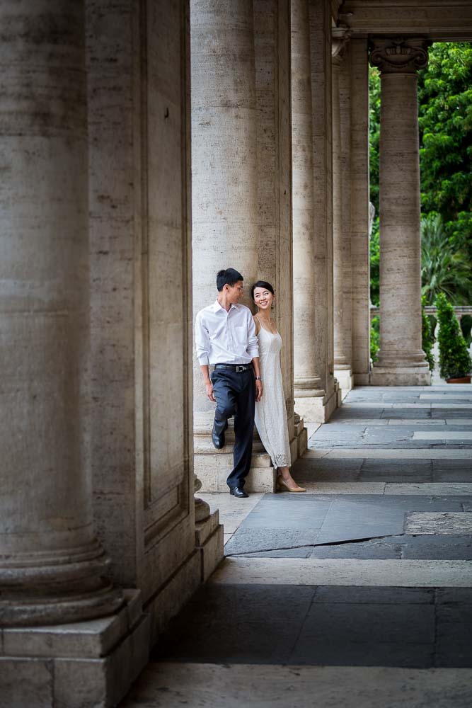 Standing by the marble columns in Piazza del Campidoglio