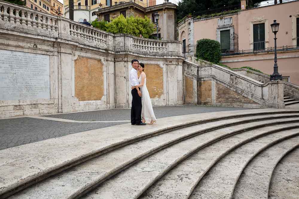 Architecture details in Piazza di Spagna with a couple taking pics as their post wedding