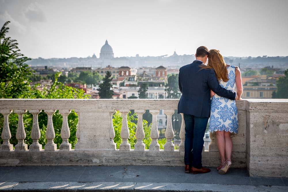 Romantic image of a couple overlooking the city of Rome from afar