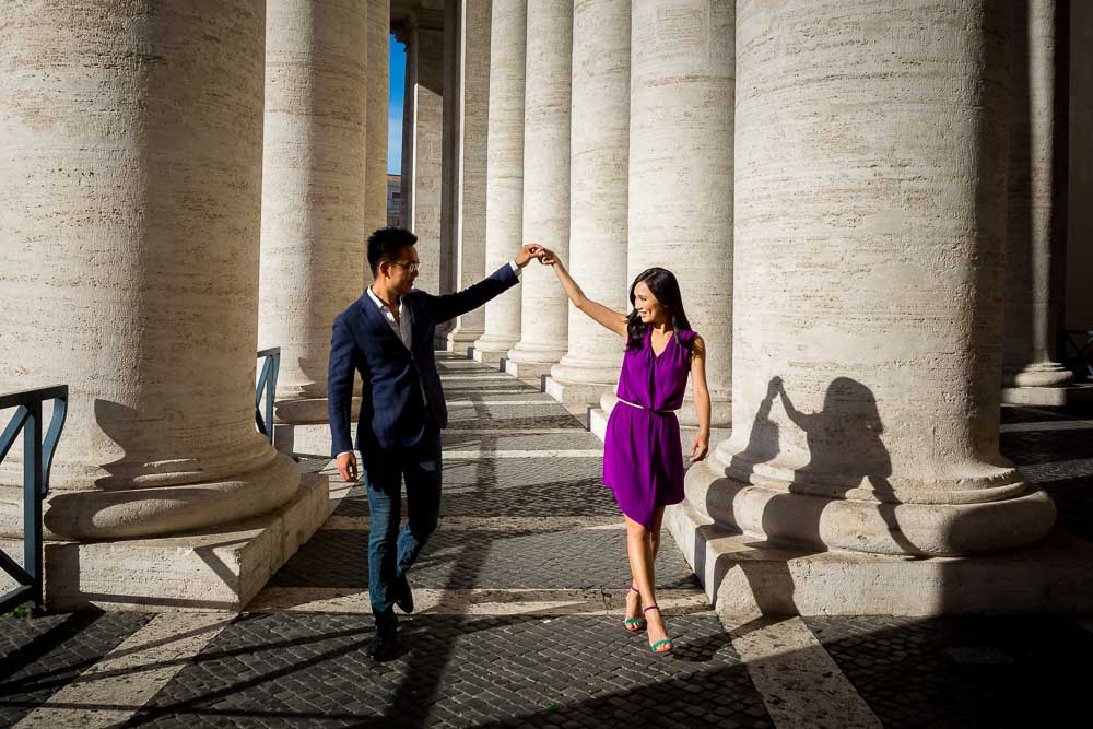 Dance walking under the St. Peter's colonnade in the Vatican city