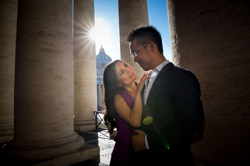 Posing in between columns with Saint Peter's dome in the distance