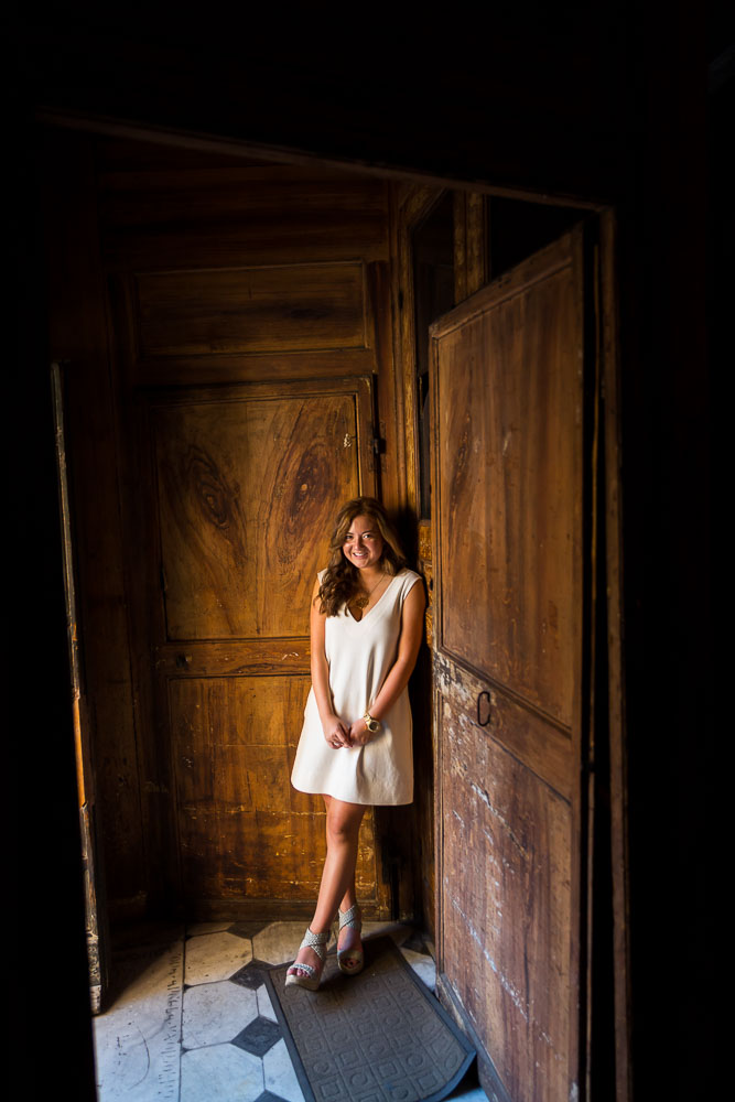 Portrait picture natural light standing in front of a church door