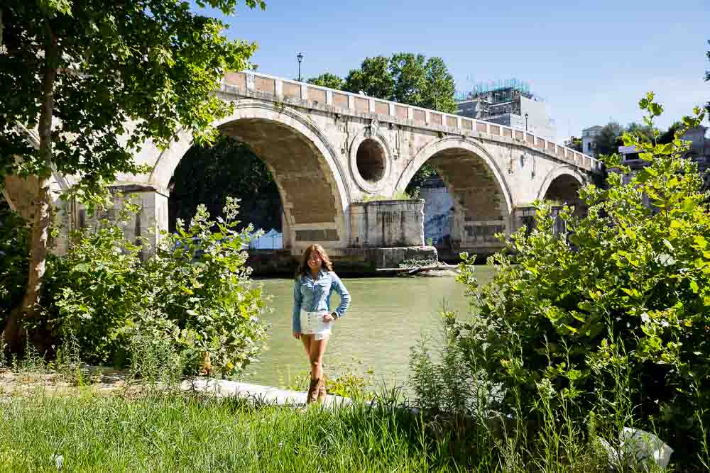 Photo session under the bridge. Standing next to the Tiber river in Rome. Ponte Sisto. Portrait photography.