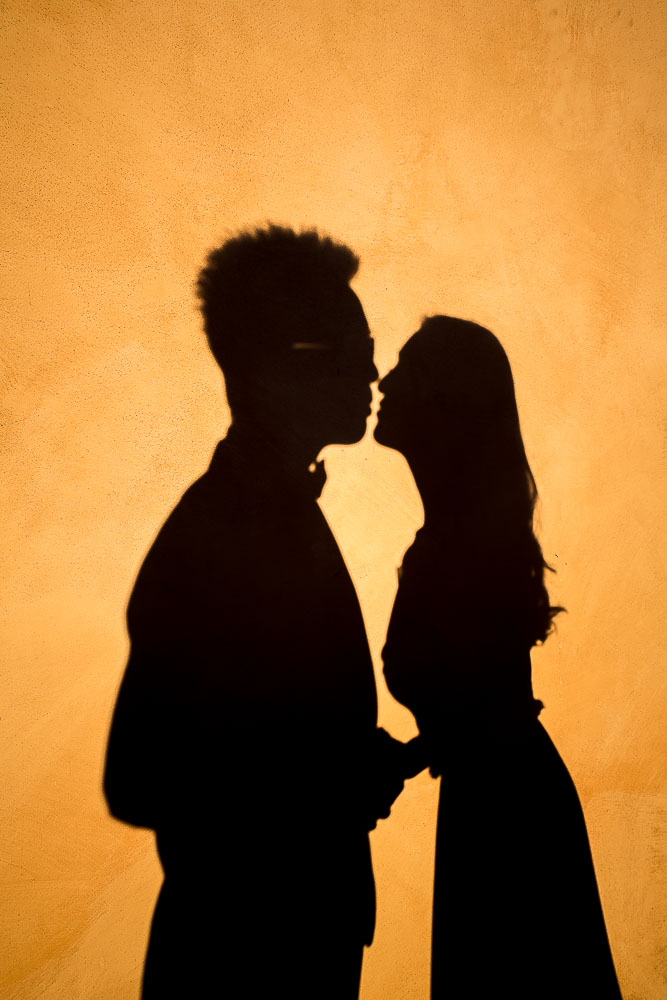 Silhouette couple kissing pre wedding