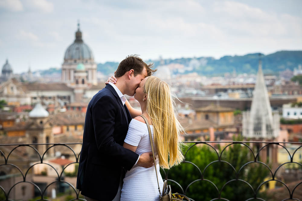 Kissing overlooking the roman rooftops