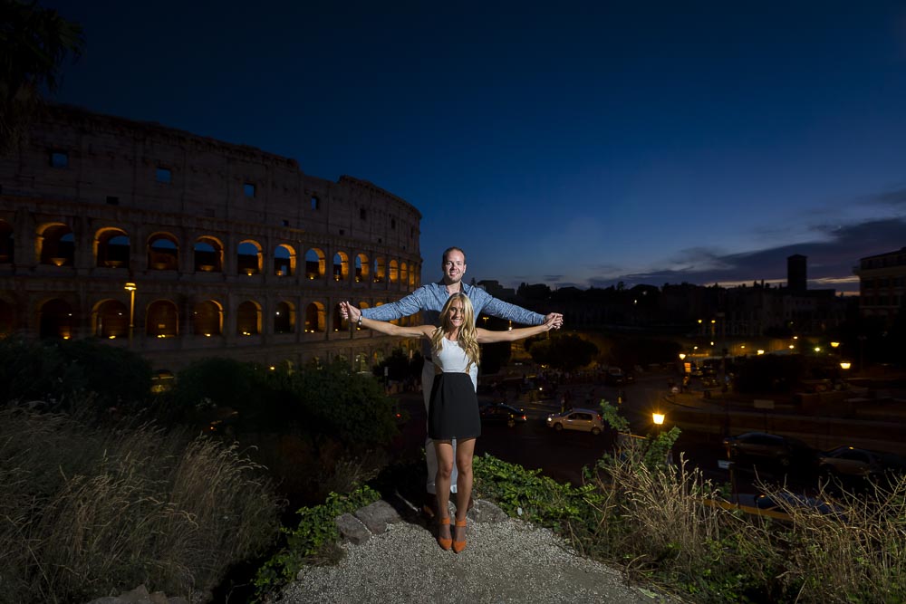 Holding hands overlooking the roman Coliseum