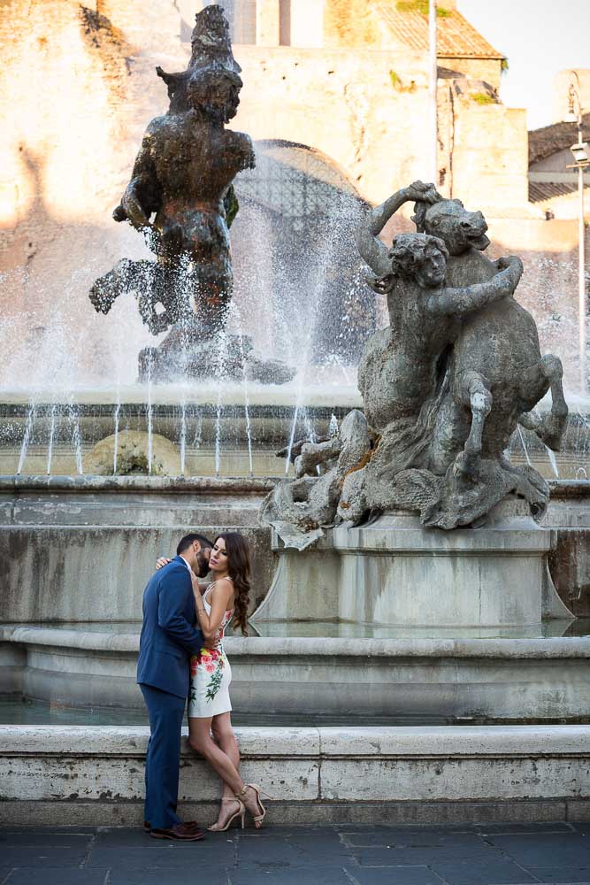 Portrait picture of a couple together by the Repubblica piazza water fountain