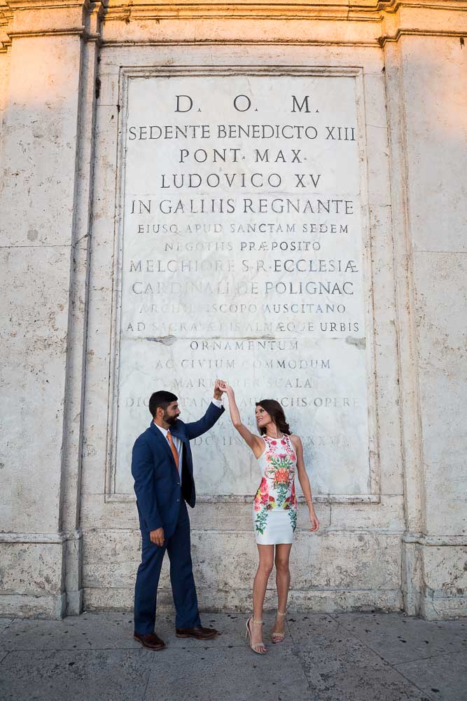 Dancing in front of large marble background