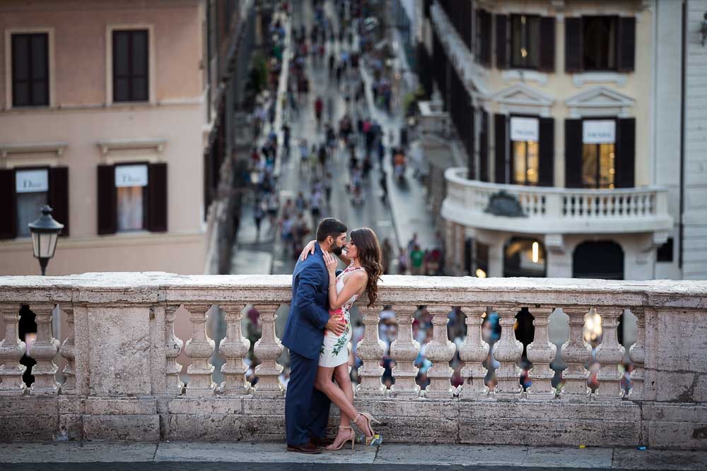 Couple together in Piazza di Spagna overlooking Via Condotti in Rome Italy