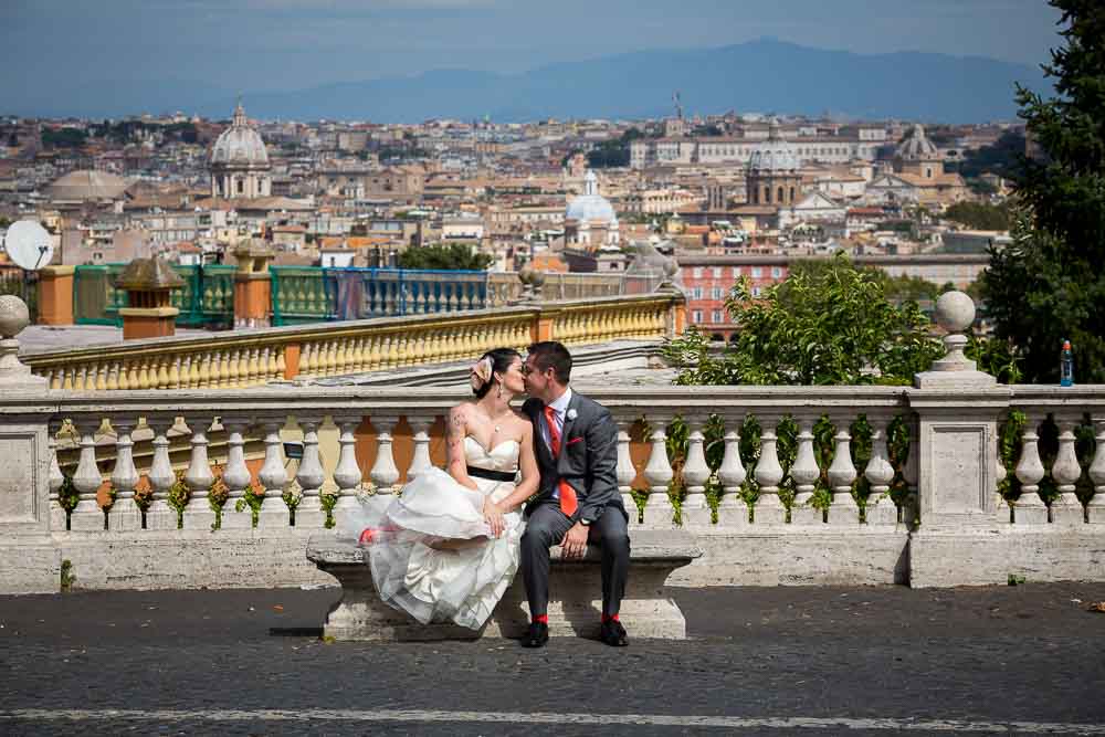 Bride and groom during their photography session in Rome Italy with the roman skyline behind them