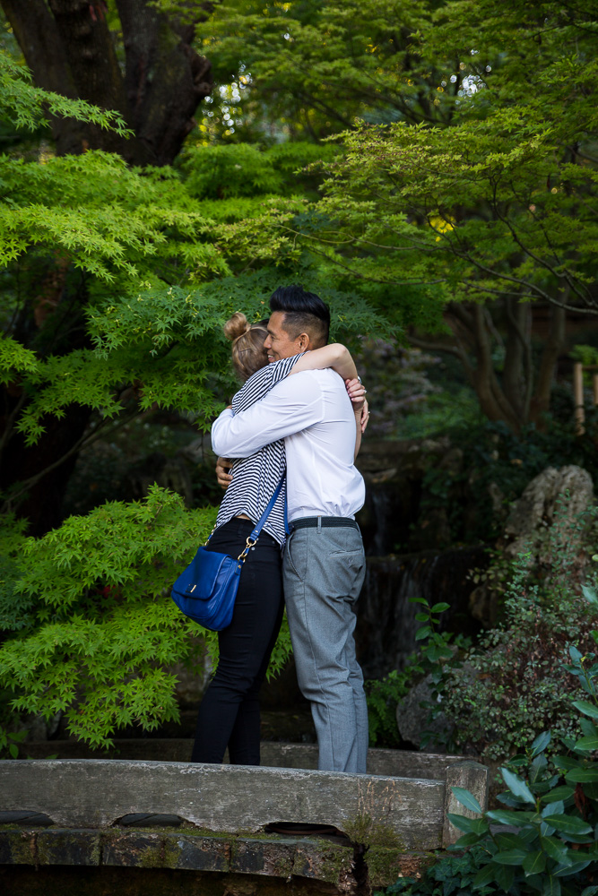 Engaged together in a beautiful botanic garden in Rome Italy. 