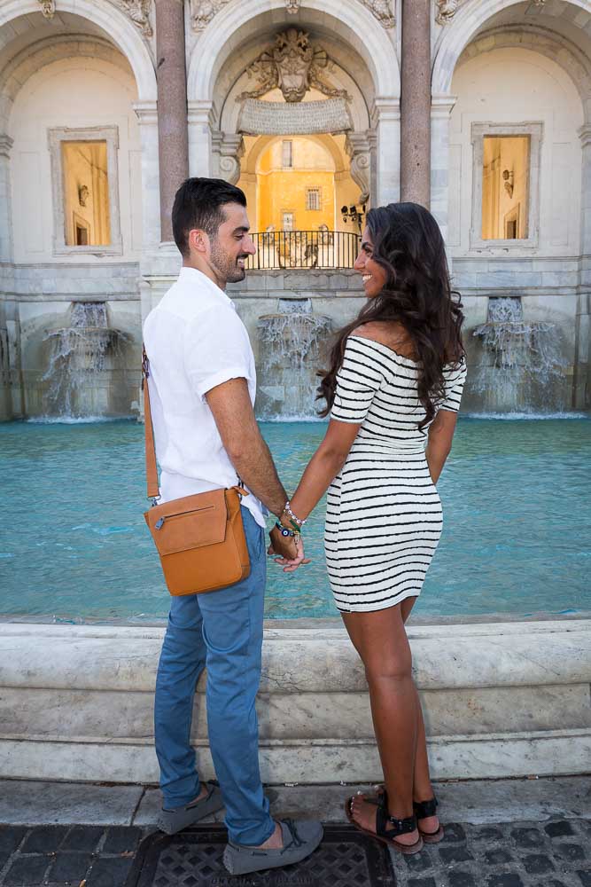 Couple posing during a photo shoot at the Gianicolo water fountain