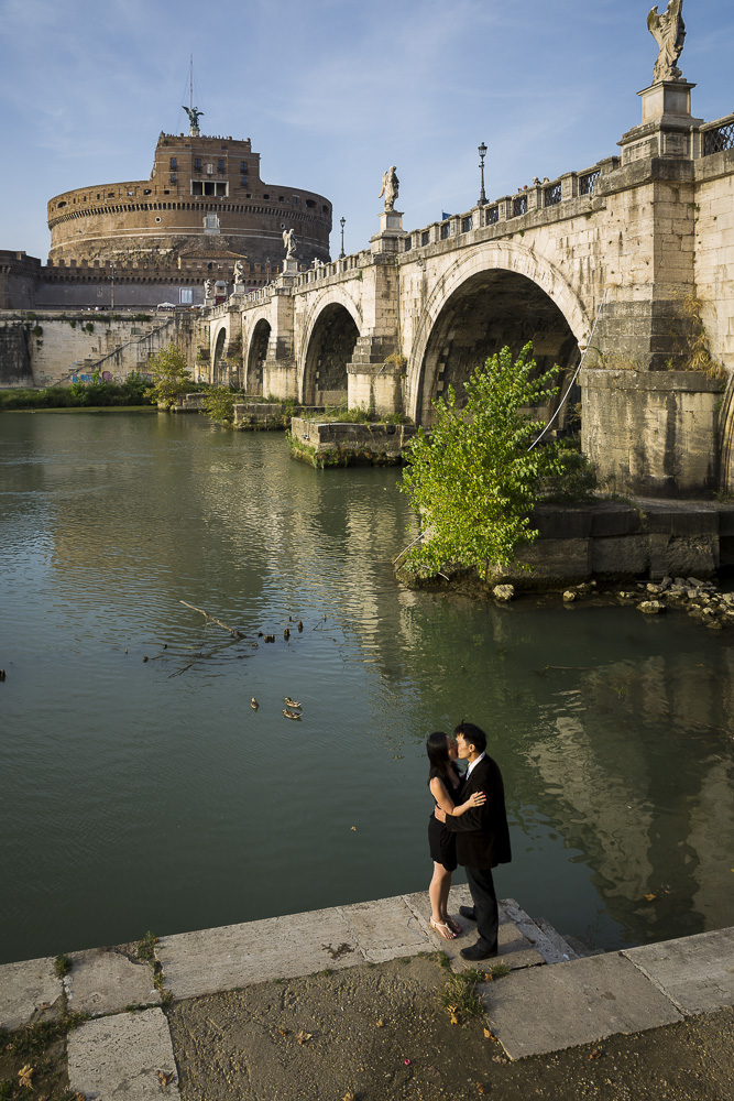Couple engagement session photos from above by the Tiber river and Castel Sant'Angelo in Rome
