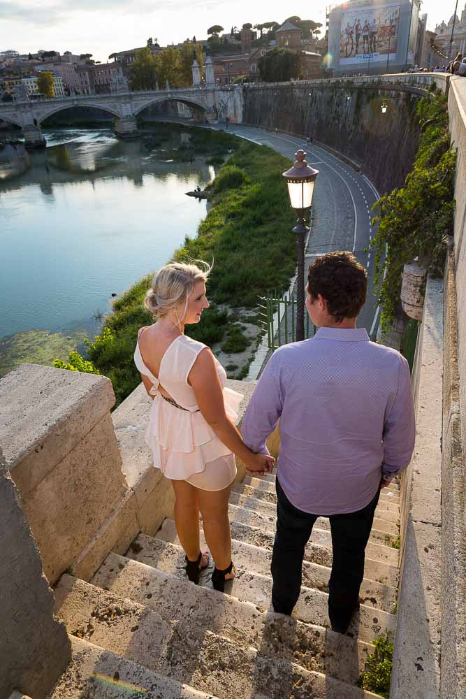 Hand in hand looking at the Tiber river