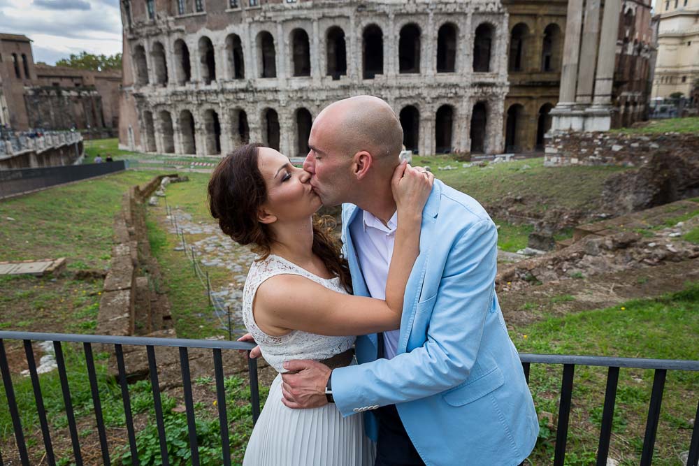 Romantically kissing in front of Teatro Marcello