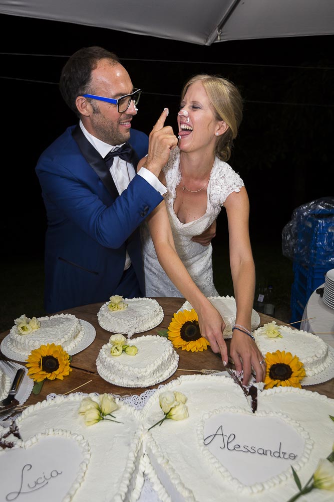 Having fun during the cutting of the cake Tuscany Wedding Italy