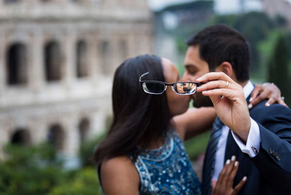 Newlywed image seen through eye glasses at the Colosseum in Rome Italy