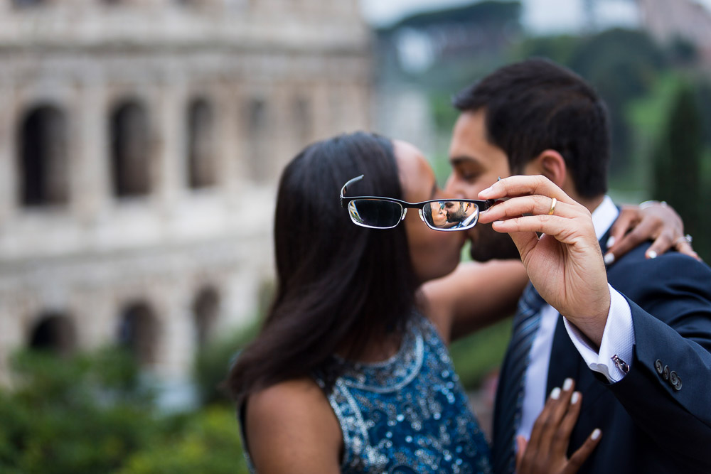 Newlywed image seen through eye glasses at the Colosseum in Rome Italy