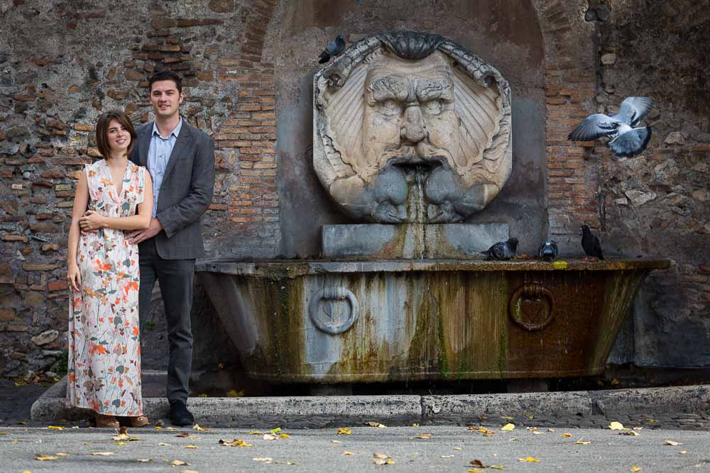 Portrait e-session picture in front of water fountain