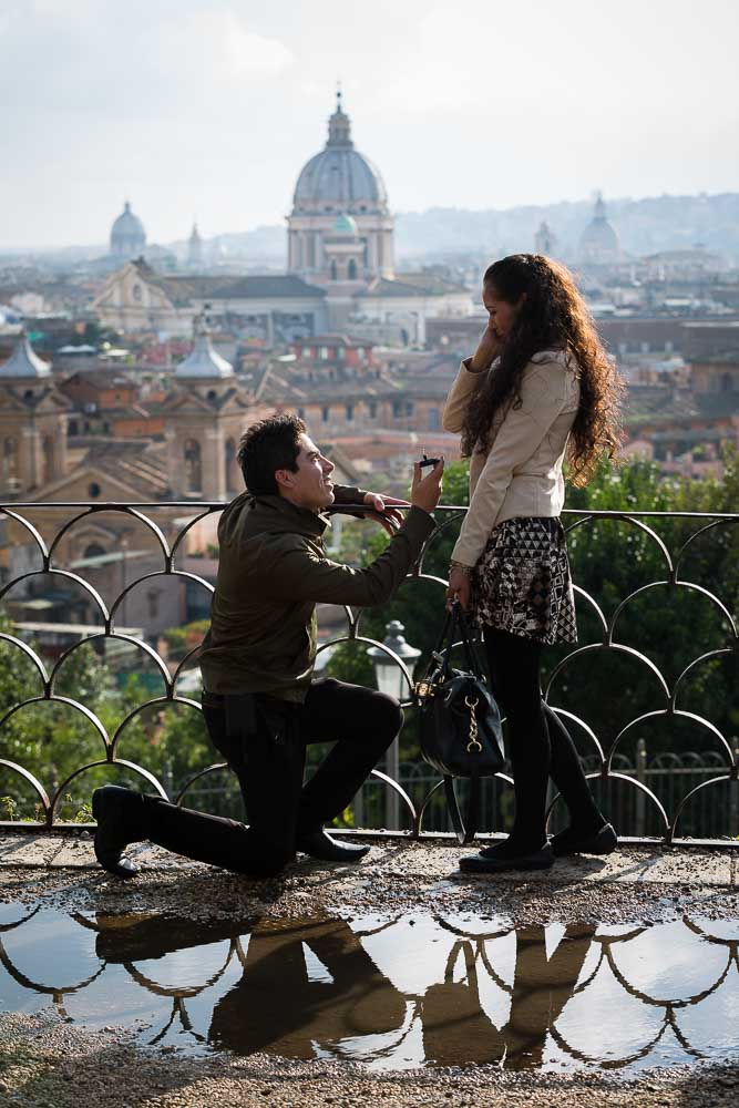 Man proposing to girlfriend at Parco del Pincio overlooking the roman view