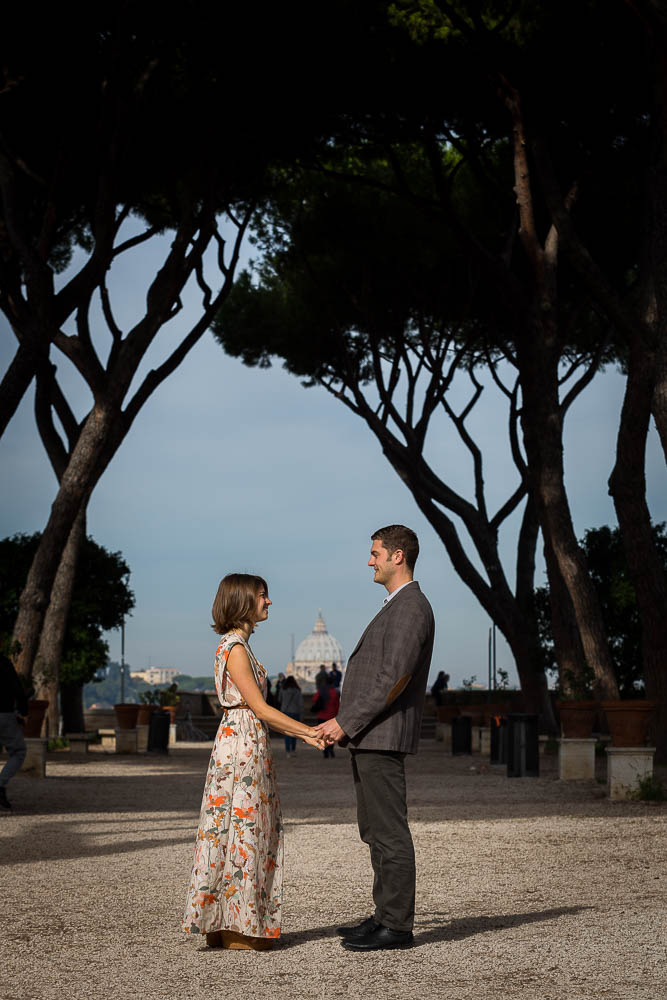 Holding hands together during an engagement session at Giardino degli Aranci