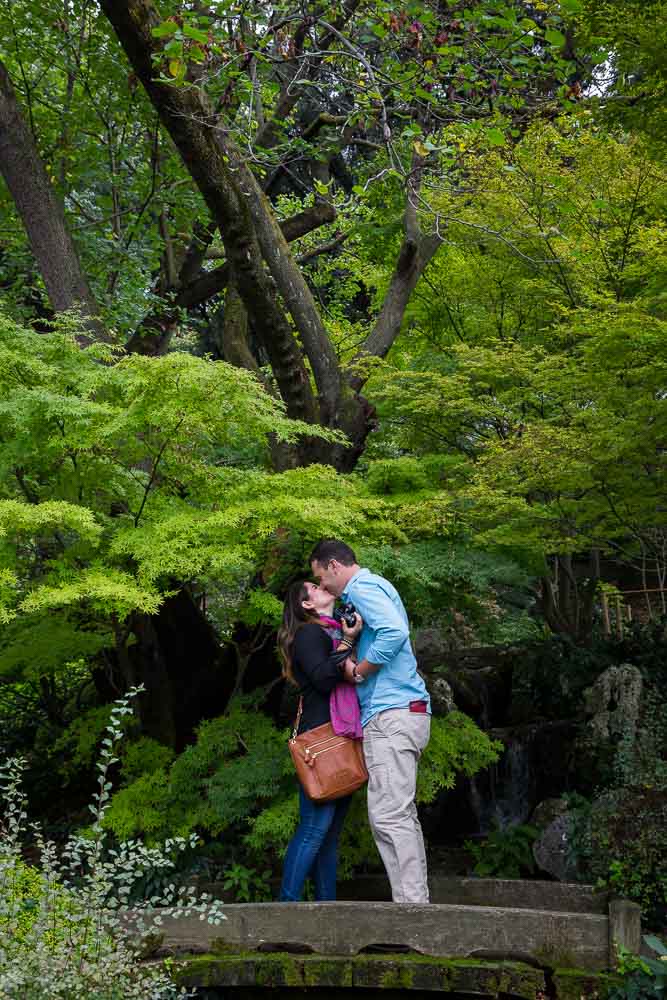 Kissing after marriage proposal in the Japanese Garden of the Rome Botanical garden