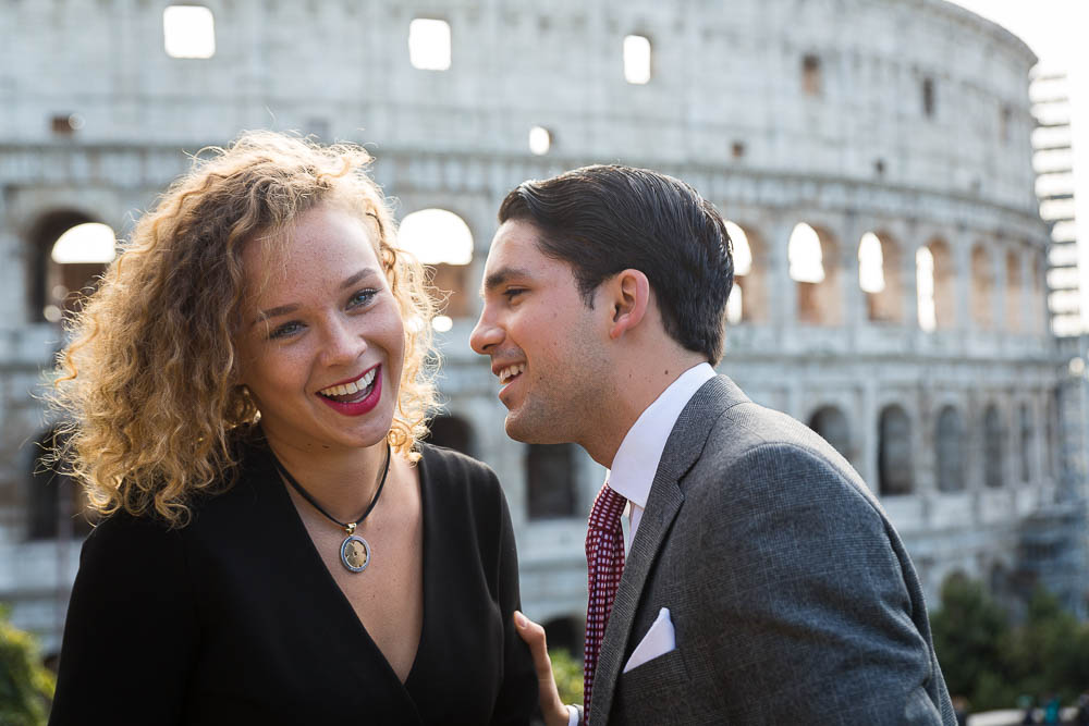Man and woman having a laugh at the Roman Colosseum