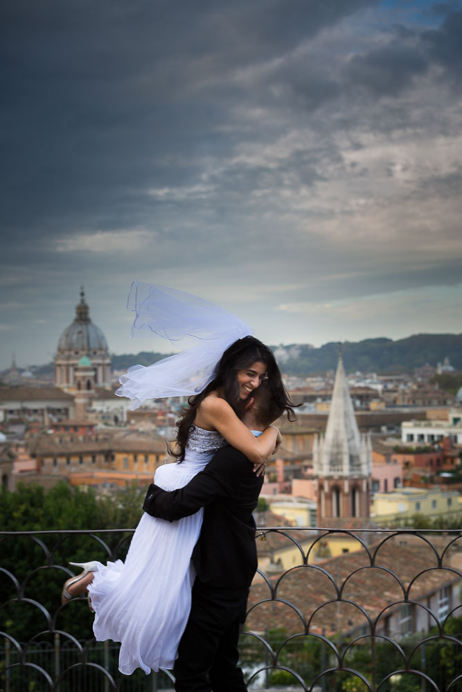 Jumping up for joy at Parco del Pincio overlooking the roman city from afar