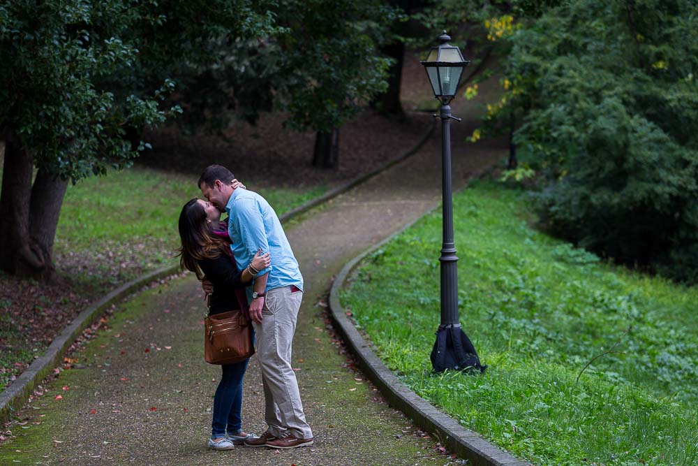 Engagement session kissing on the path