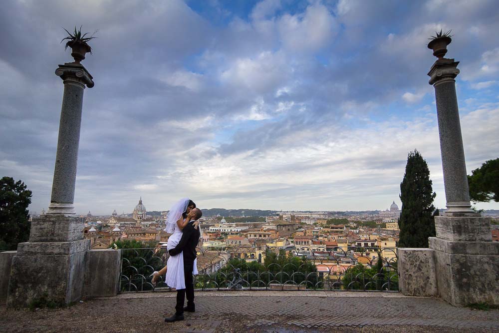 Wide angle view of bride and groom at Pincio park