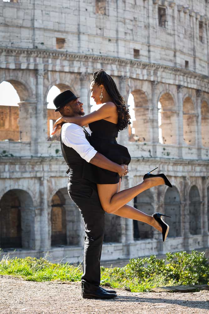 Rome engagement shots at the Roman Colosseum. Picking up girlfriend in the air.