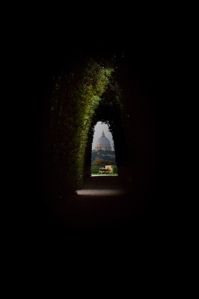 The keyhole view of Saint Peter's dome from the Cavalieri di Malta door in Rome Italy