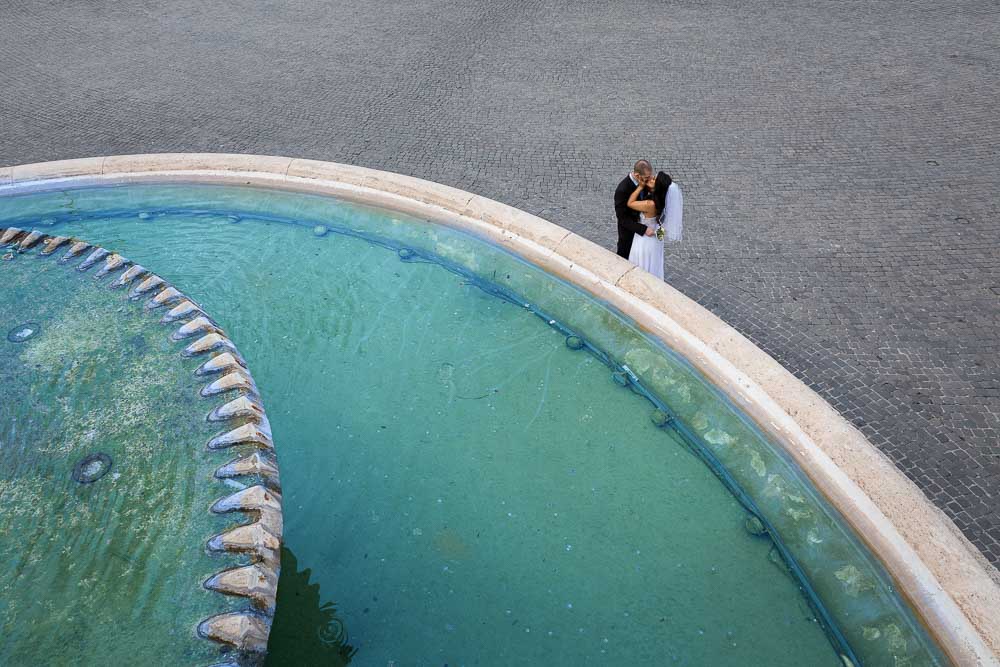 Standing next to pool water in a square