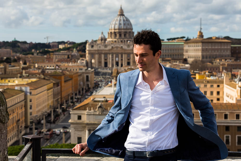 Portrait picture with Saint Peter's dome in the far distance. Spectacular view. Model Photo Shoot in Rome.