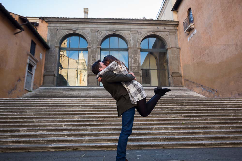 Man picking up woman