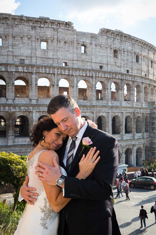 Portrait picture of a just married couple by the coliseum