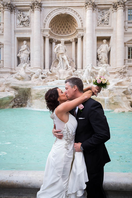 Married and in love at Fontana di Trevi in Rome