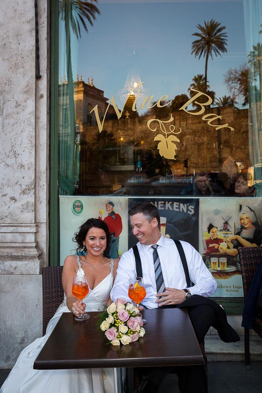 Couple sitting down at a bar having drinks