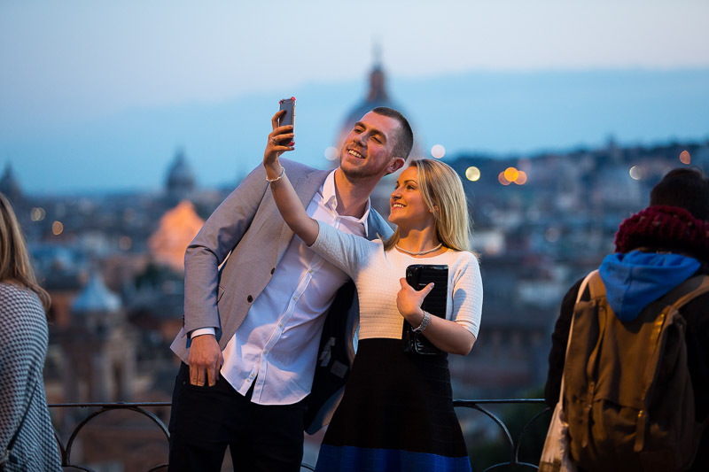 Couple taking a selfie in a scenic roman place