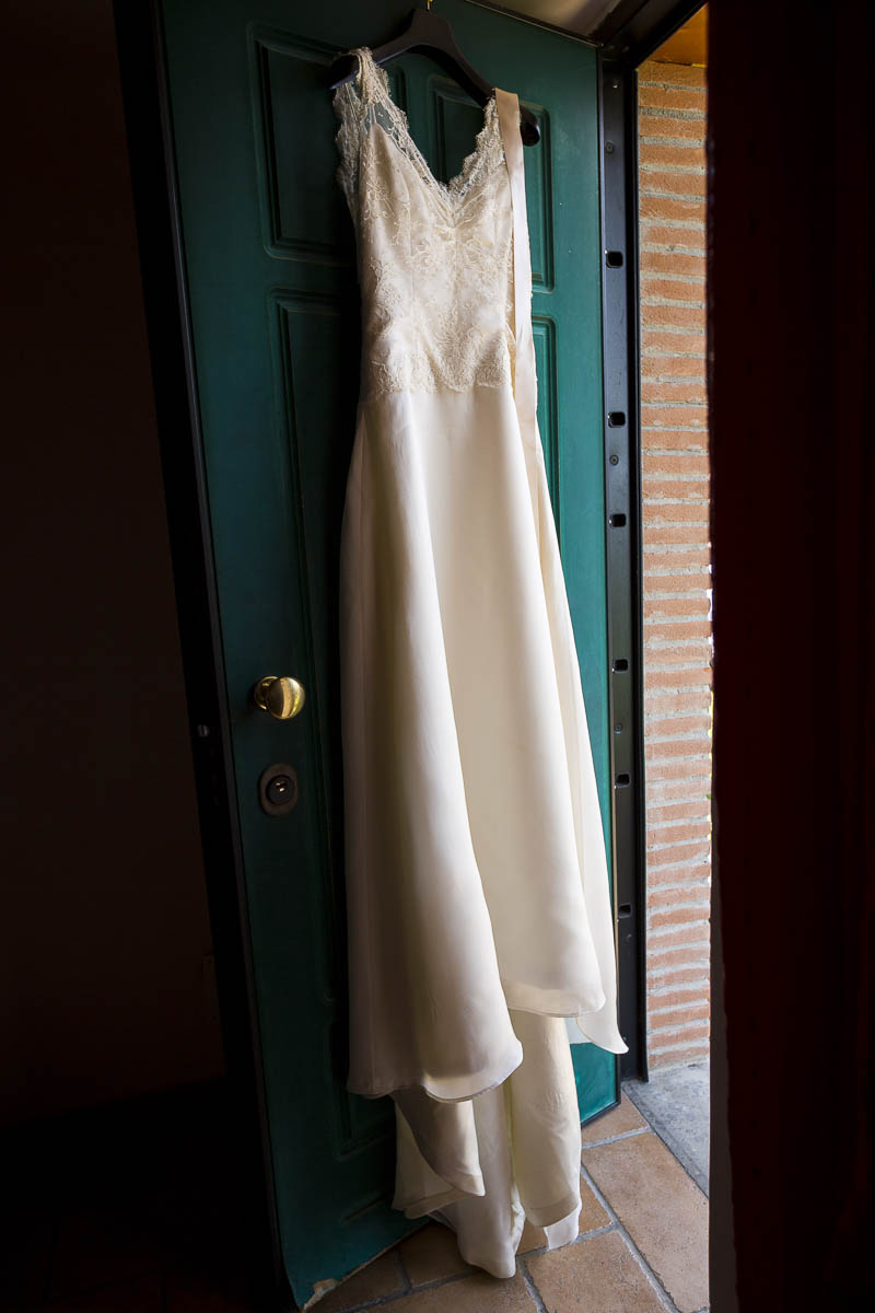 Marriage dress hanging from a door